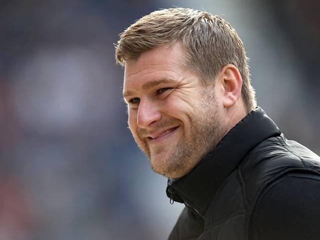 MK Dons boss Karl Robinson should be smiling on Sunday... for 45 minutes at least